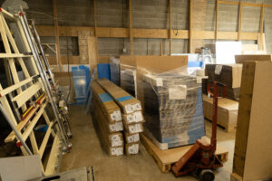 Supplies and frames as part of a Peterson Picture commercial framing project are stored safely in the Peterson Picture Co. facility. Framing materials are ready to be used in custom framing projects.