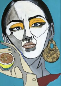 Lemon is a beautiful art piece by Luis Guzman displayed at the Peterson Picture Co. in-house gallery. The image shows a person wearing earrings and vibrant makeup, holding a lemon.